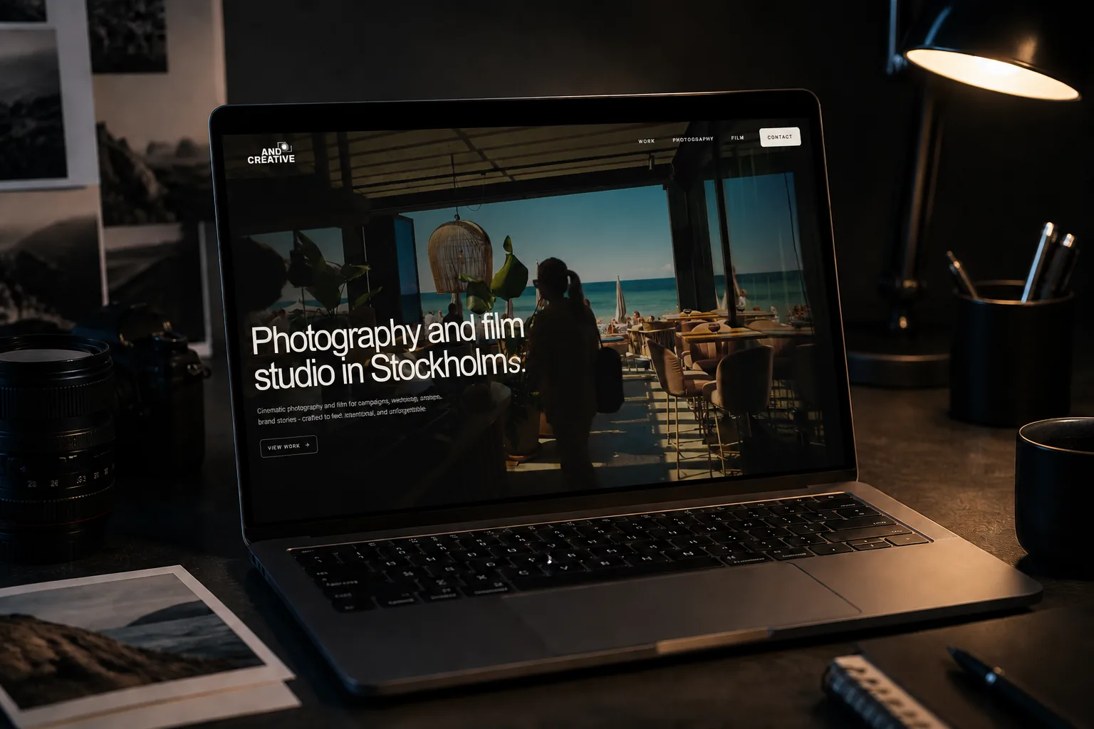 The Andcreative homepage on a laptop